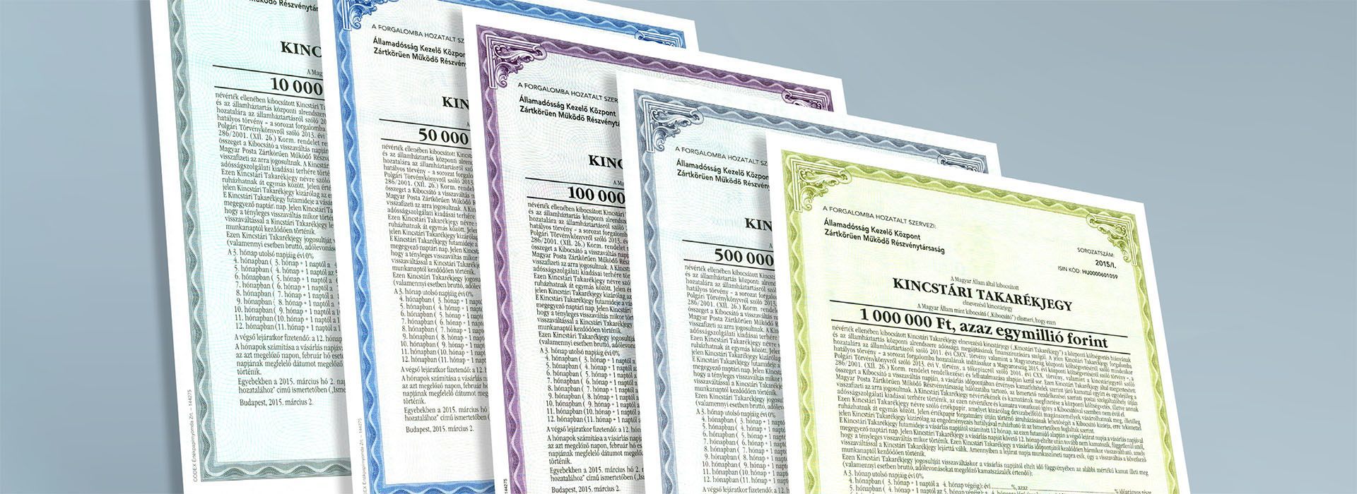 A képen küldönböző címletü Kincstári Takarékjegyek szerepelnek